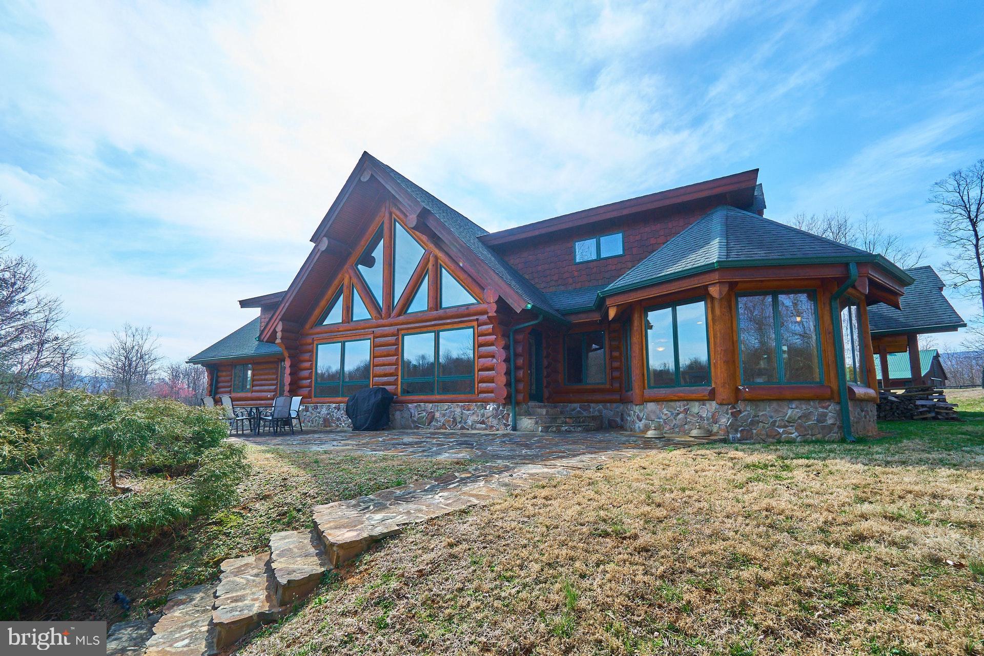 View  of home w? stone.steps leading to the lake