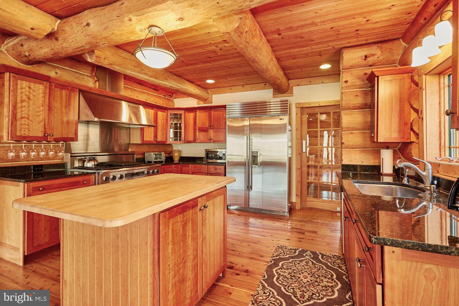 14047 Hume Road Hume, VA 22639 - Photo 20 of 73 Granite Counter tops & botcher block & wine rack