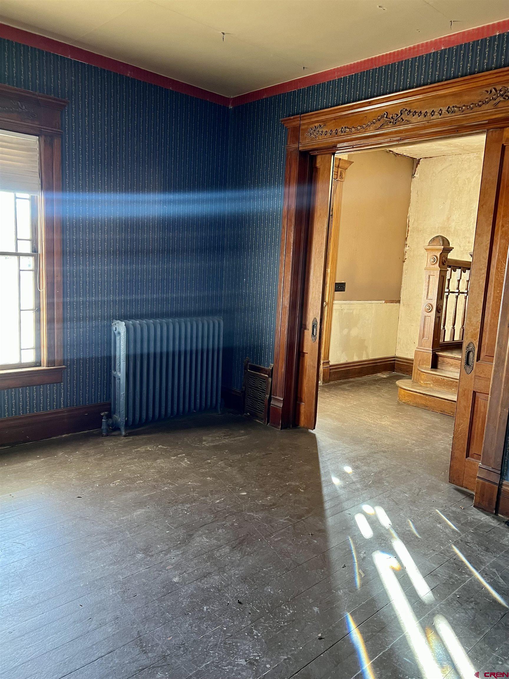 509 Leon Street Delta, CO 81416 - Photo 16 of 35 a view of an empty room with a fireplace