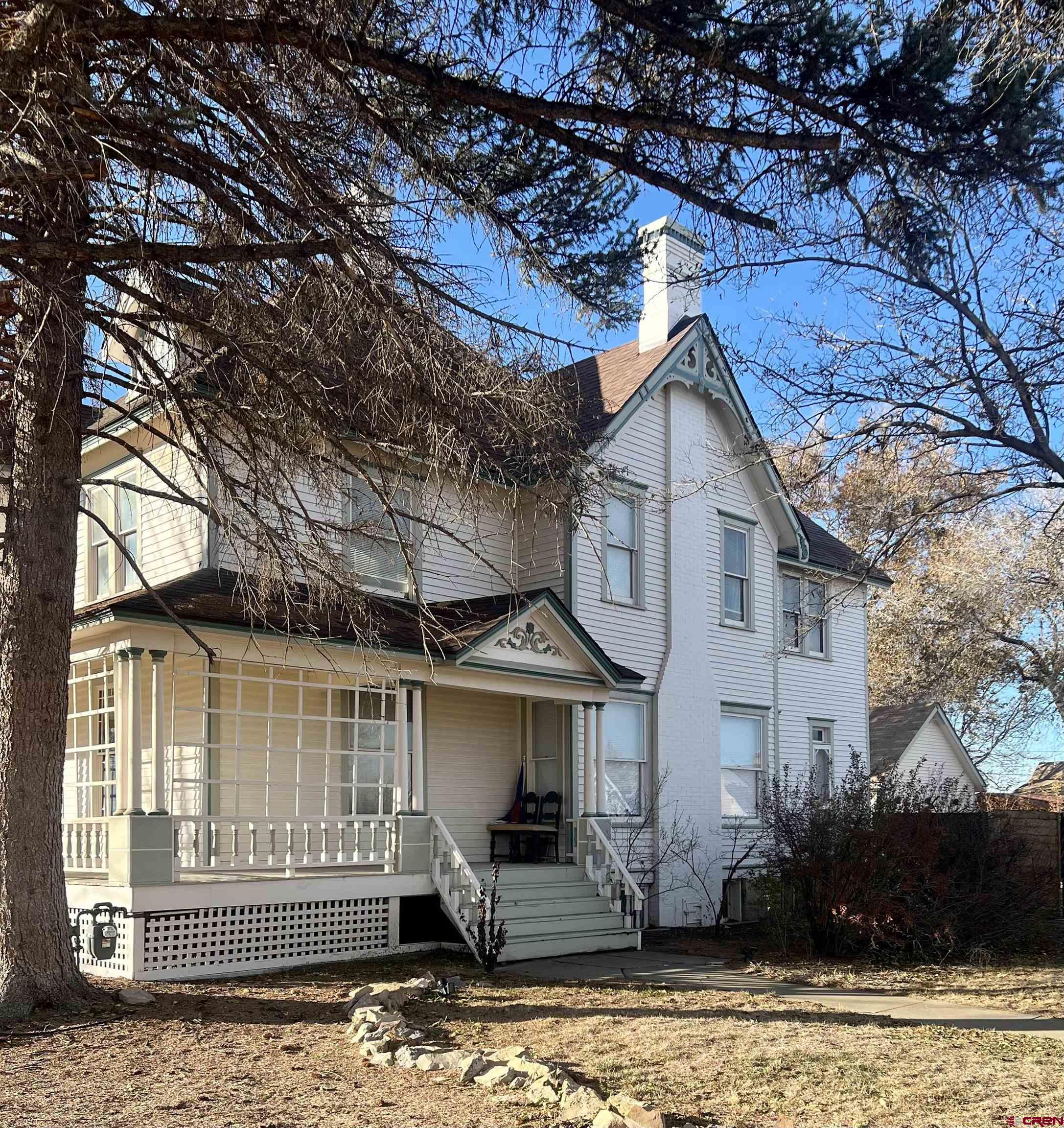 509 Leon Street Delta, CO 81416 - Photo 2 of 35 a front view of a house with garden