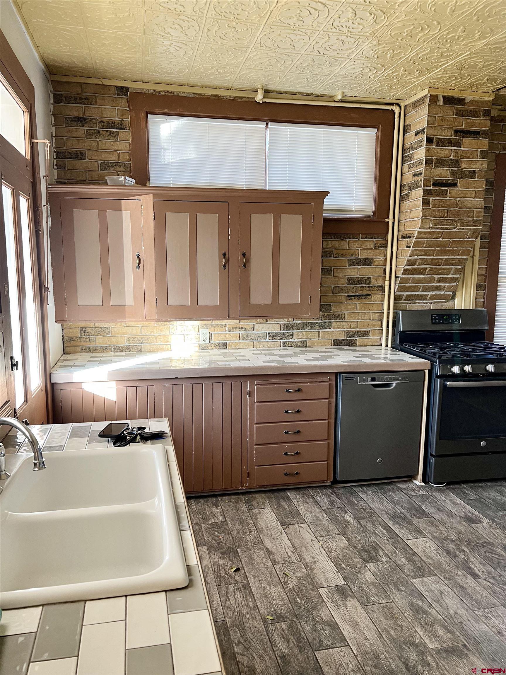 509 Leon Street Delta, CO 81416 - Photo 21 of 35 a bathroom with a tub sink and mirror