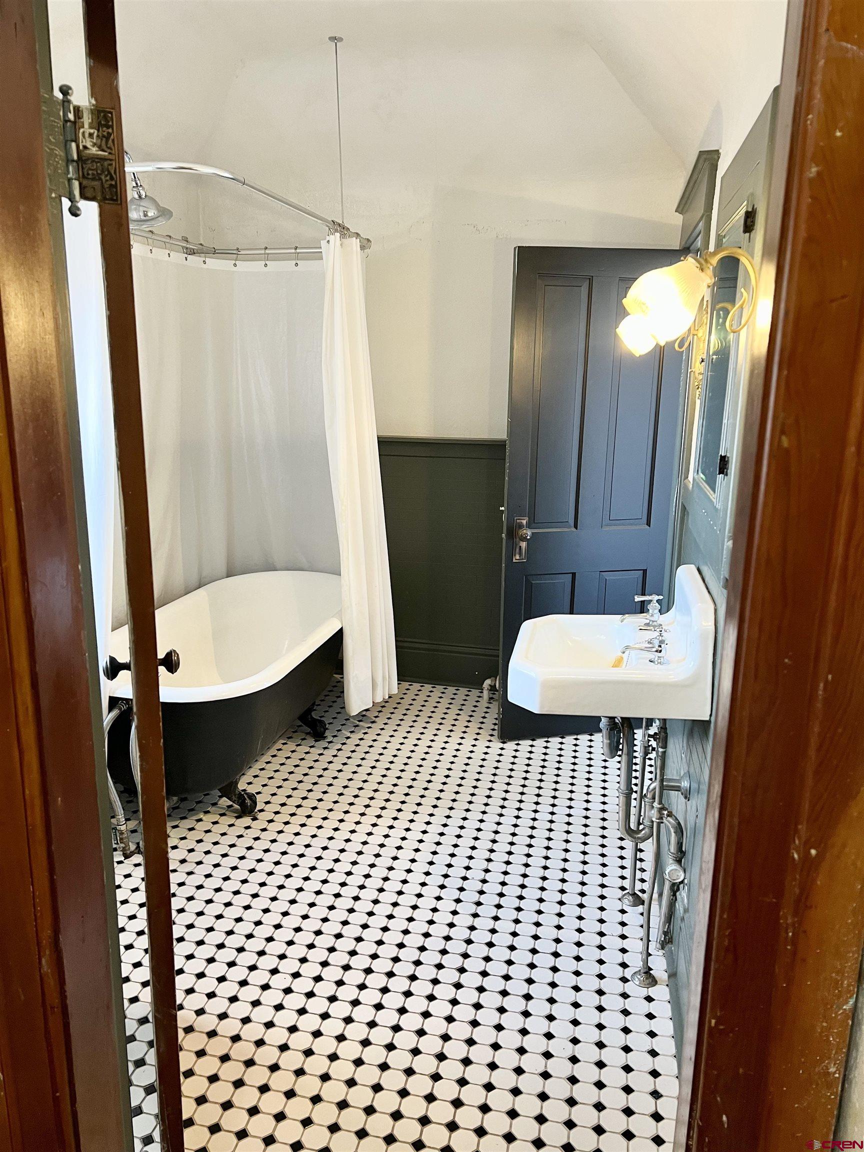 509 Leon Street Delta, CO 81416 - Photo 25 of 35 a bathroom with a sink and a mirror