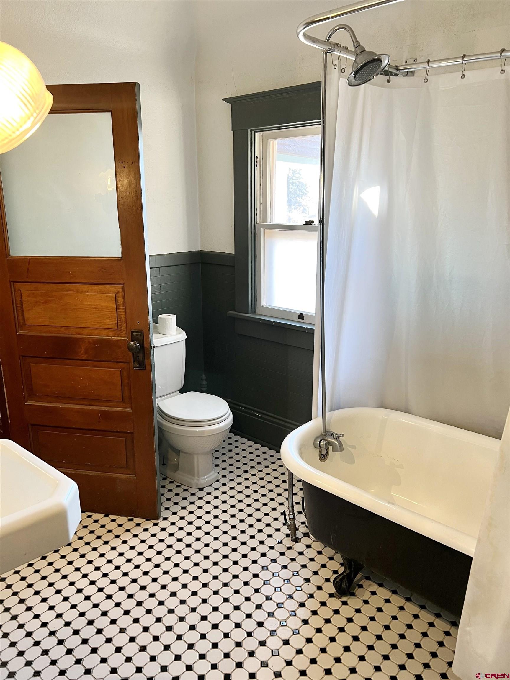 509 Leon Street Delta, CO 81416 - Photo 26 of 35 a bathroom with a sink a toilet a shower and a mirror
