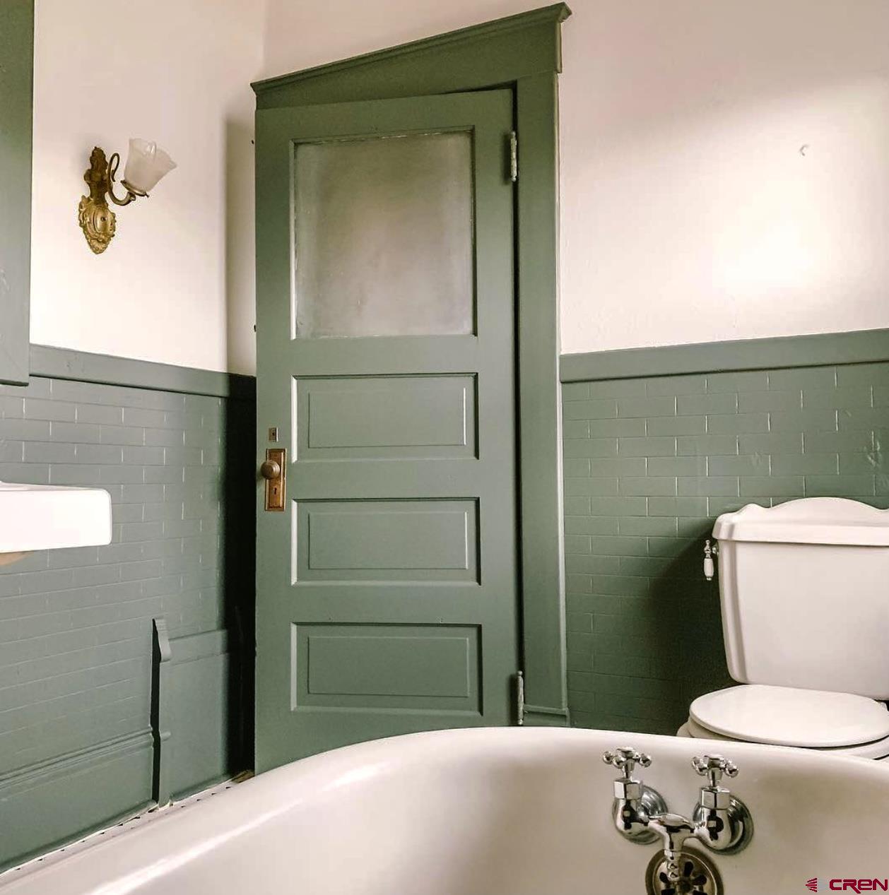 509 Leon Street Delta, CO 81416 - Photo 27 of 35 a bathroom with a toilet and a sink