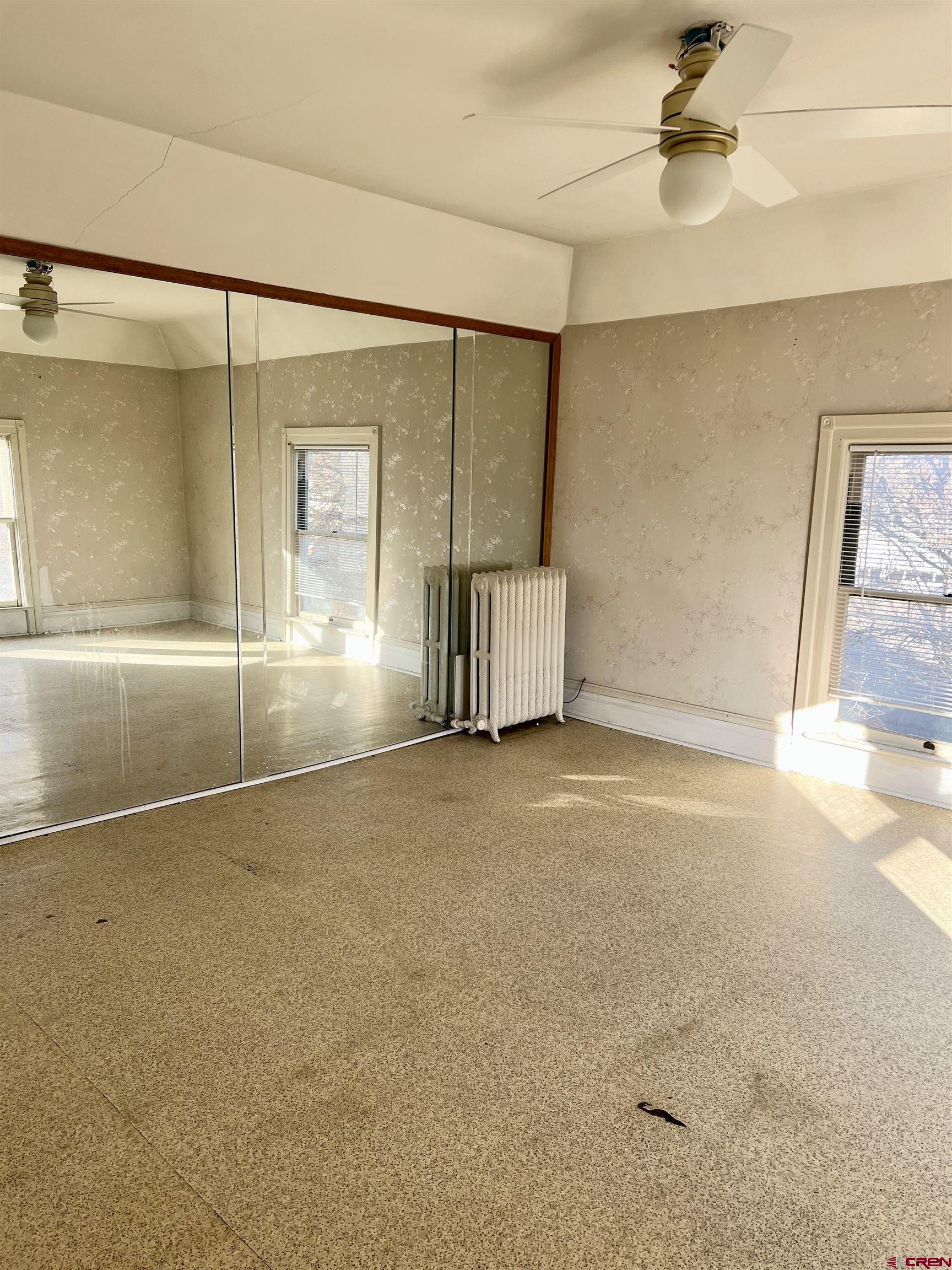 509 Leon Street Delta, CO 81416 - Photo 28 of 35 an empty room with a empty space and windows