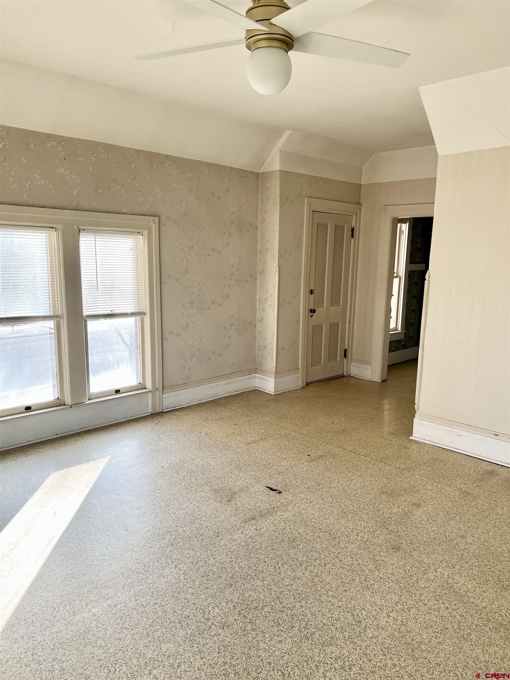 509 Leon Street Delta, CO 81416 - Photo 29 of 35 an empty room with windows and closet