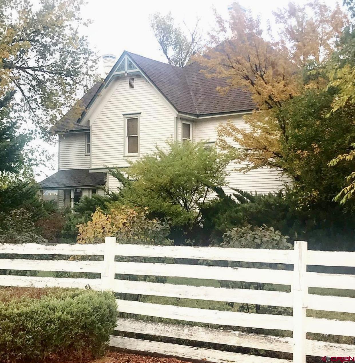 509 Leon Street Delta, CO 81416 - Photo 7 of 35 a front view of a house with a yard