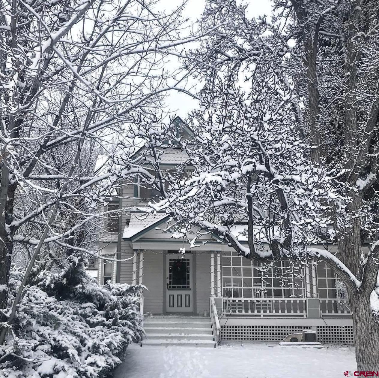 509 Leon Street Delta, CO 81416 - Photo 8 of 35 a front view of a house with a garden