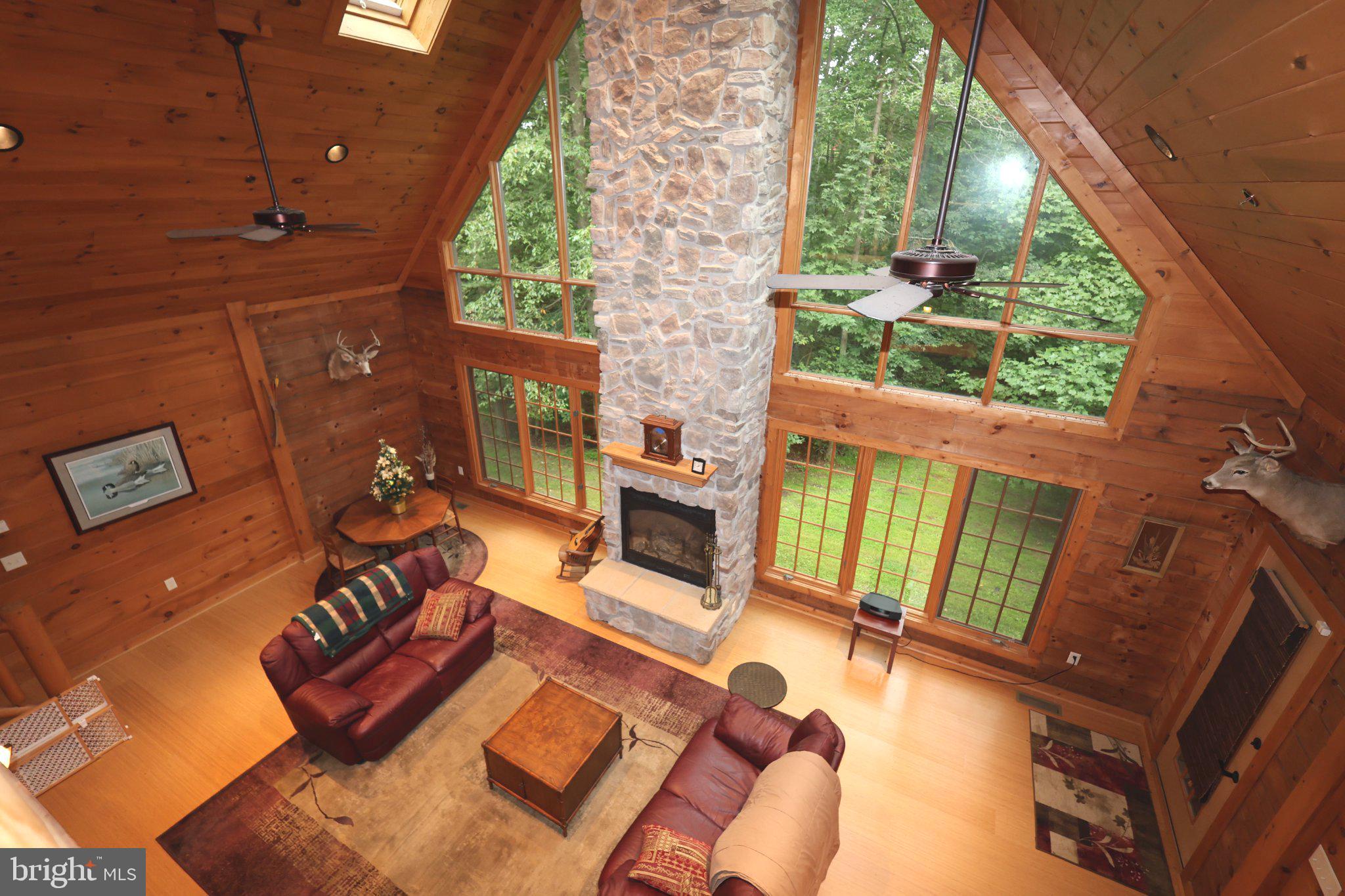 14520 Ridenour Road Smithsburg, MD 21783 - Photo 8 of 37 Cozy cabin retreat with stone fireplace.