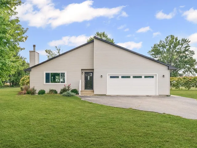 a view of a backyard of the house
