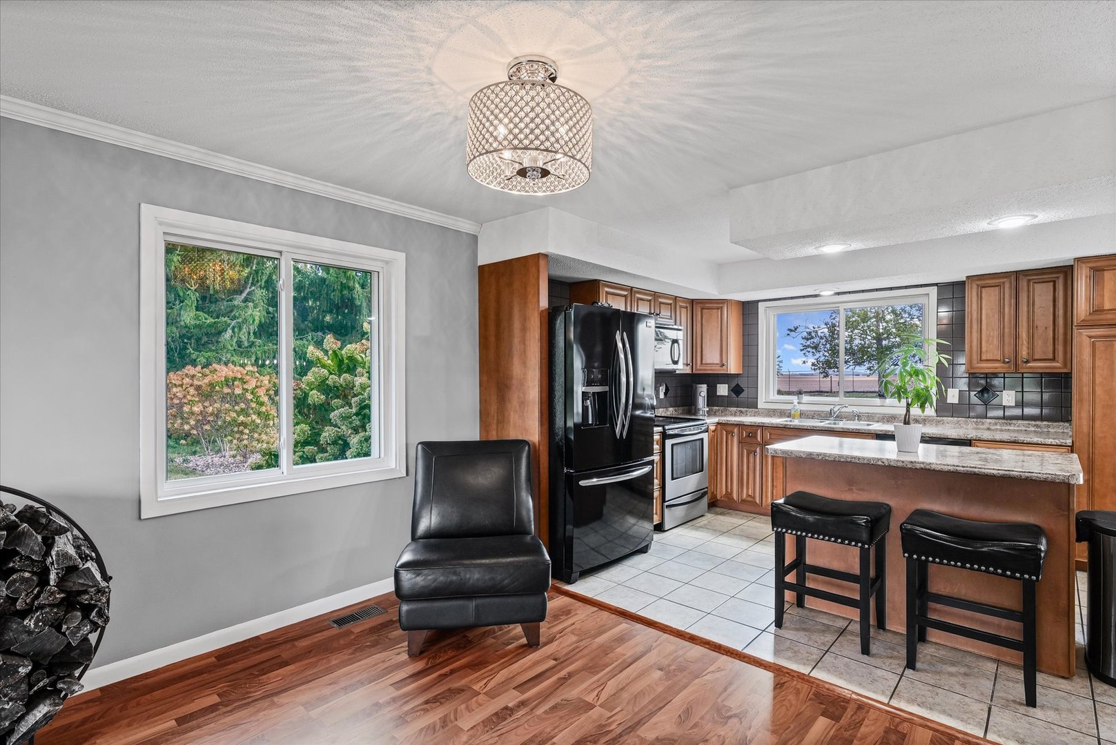 1707 West Old Church Road Champaign, IL 61822 - Photo 12 of 32 a dining hall with stainless steel appliances granite countertop a stove and a refrigerator