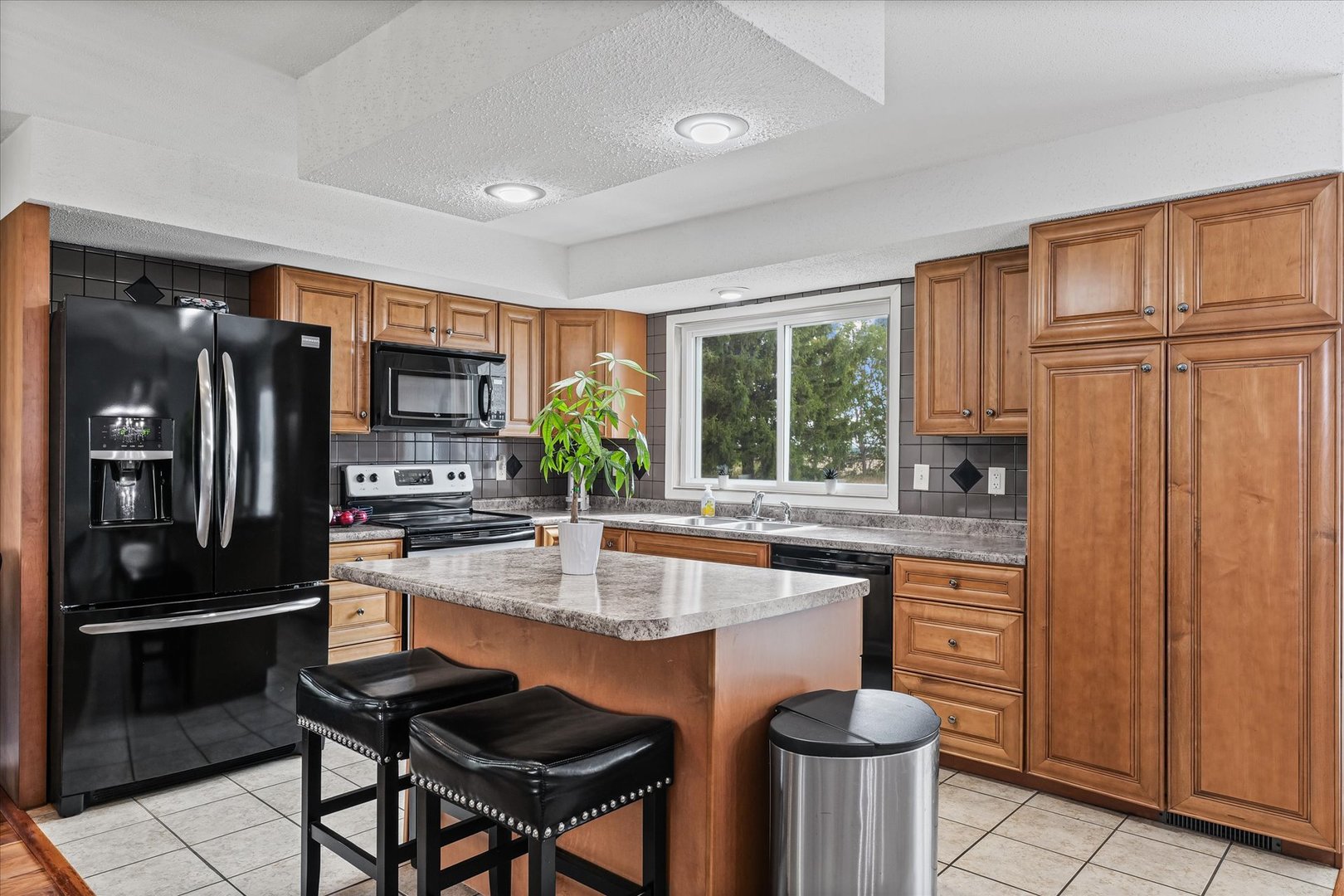 1707 West Old Church Road Champaign, IL 61822 - Photo 14 of 32 a kitchen with stainless steel appliances granite countertop a refrigerator and a stove top oven