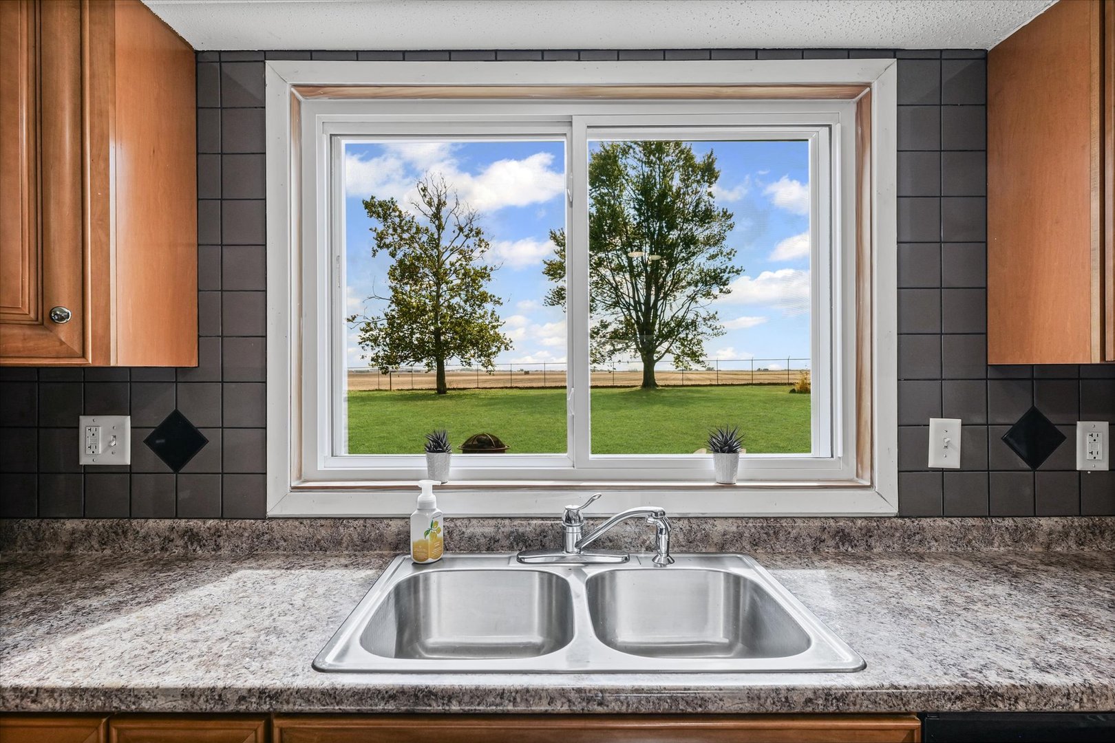 1707 West Old Church Road Champaign, IL 61822 - Photo 17 of 32 a kitchen sink with a granite countertop window and sink