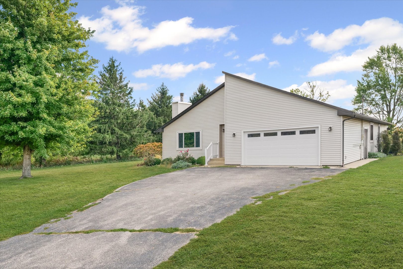 1707 West Old Church Road Champaign, IL 61822 - Photo 2 of 32 a view of a house with backyard and garden
