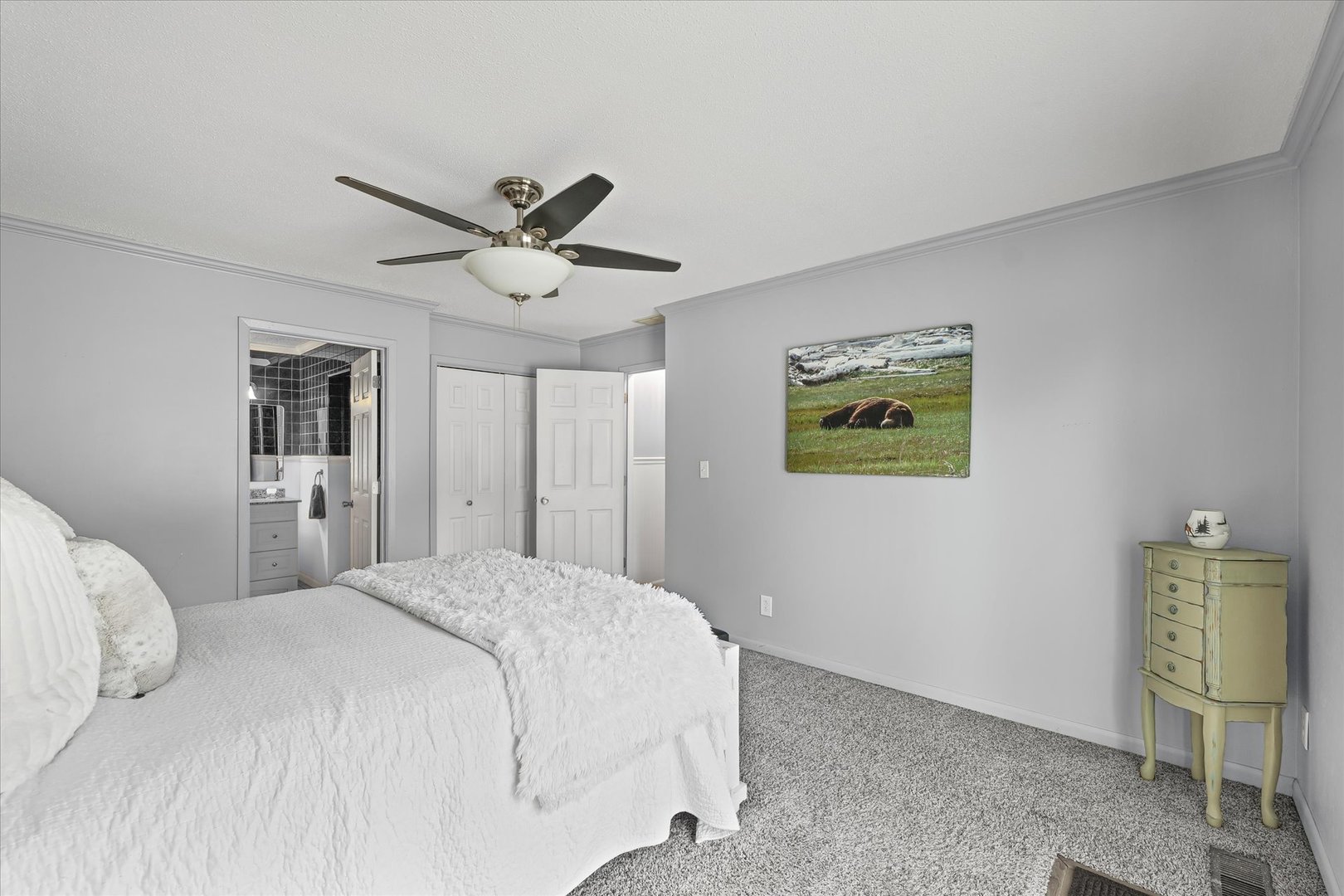 1707 West Old Church Road Champaign, IL 61822 - Photo 25 of 32 a bedroom with a bed and a chandelier