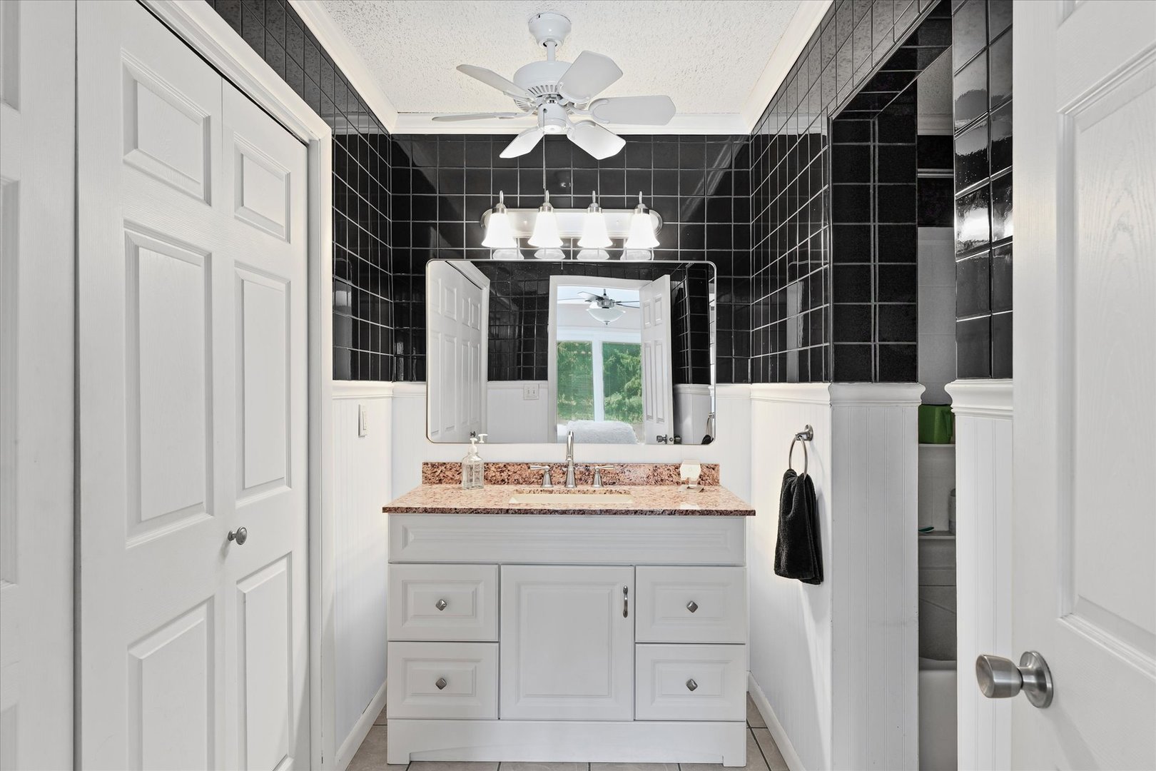 1707 West Old Church Road Champaign, IL 61822 - Photo 26 of 32 a bathroom with a sink vanity and a mirror