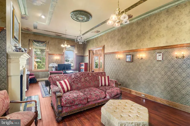 a view of a livingroom with furniture window and wooden floor