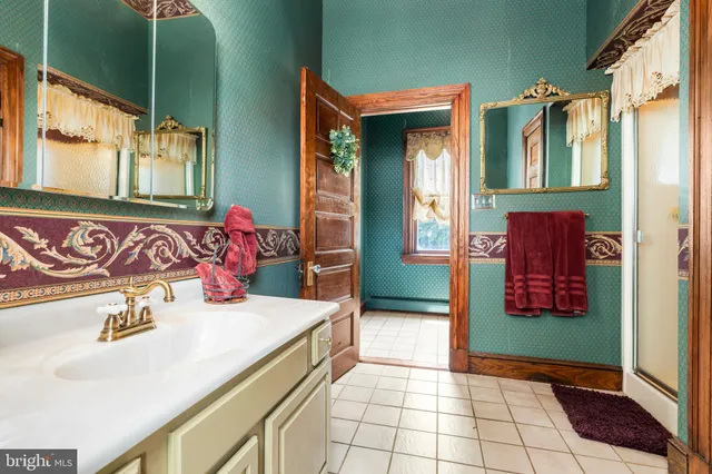 a living room with fireplace furniture and a flat screen tv