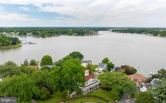 a front view of a house with plants