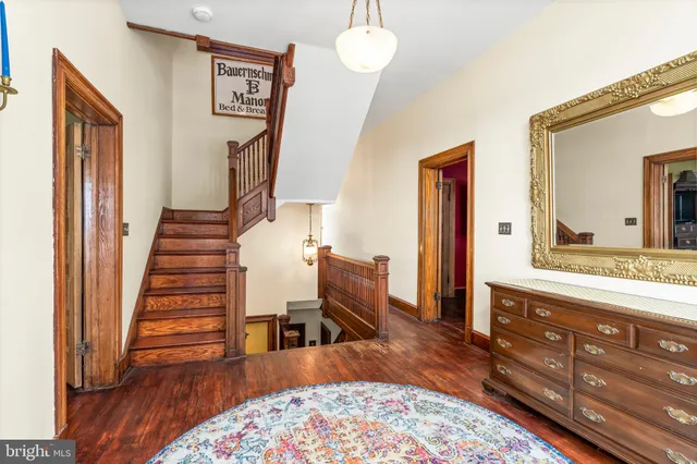 a view of a house with a yard and garden