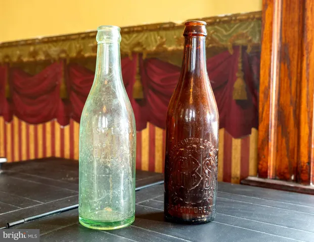 a bedroom with furniture and a large window