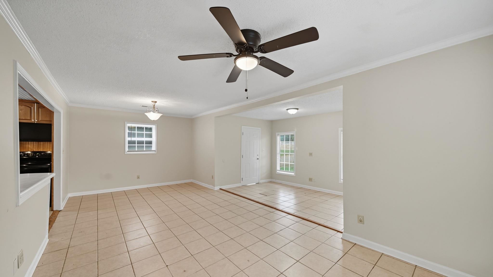 1503 Beaver Road Munford, TN 38058 - Photo 12 of 29 a view of empty room with wooden floor and ceiling fan