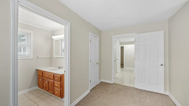 a view of an empty room and bathroom