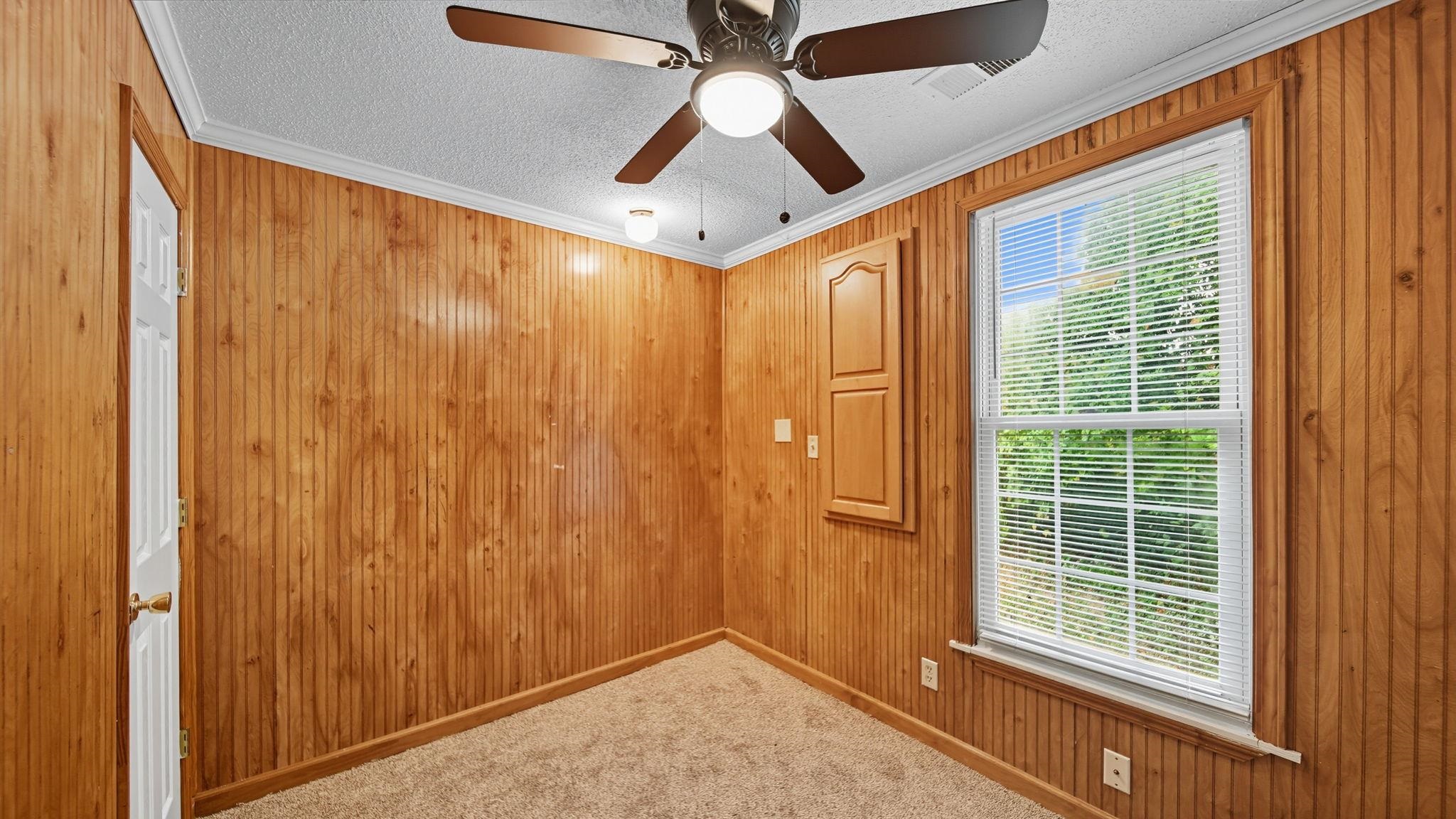 1503 Beaver Road Munford, TN 38058 - Photo 19 of 29 a view of a hallway with a large window and chandelier fan