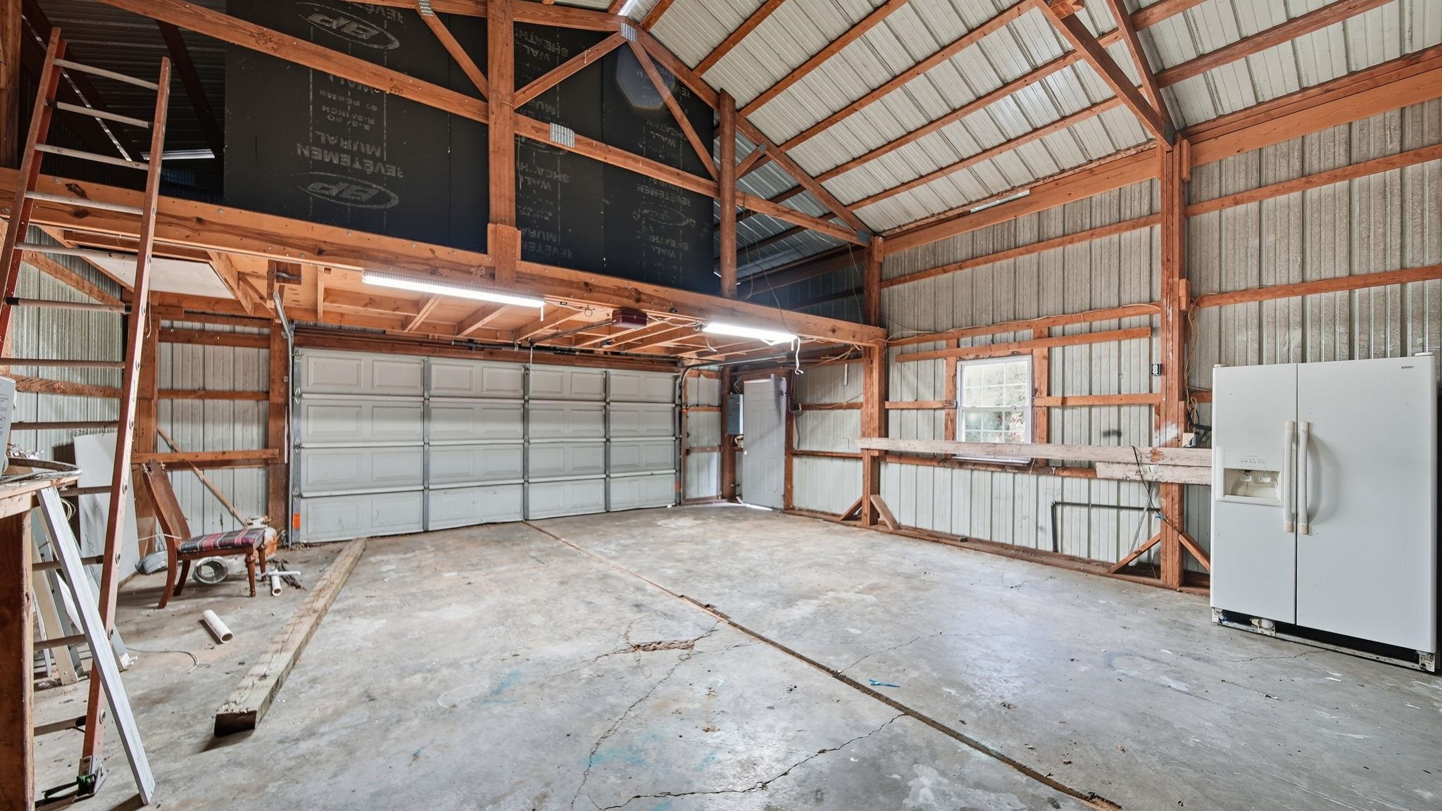 1503 Beaver Road Munford, TN 38058 - Photo 21 of 29 a view of a garage with wooden wall