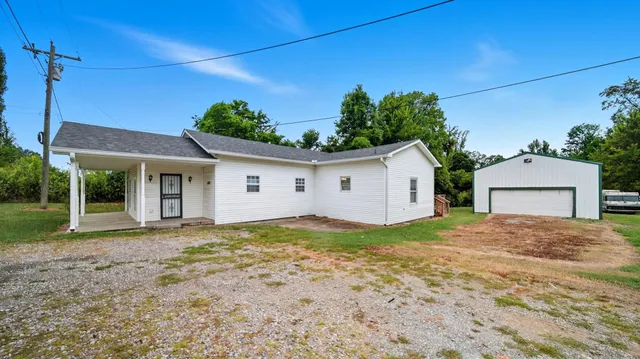 a view of a house with a yard