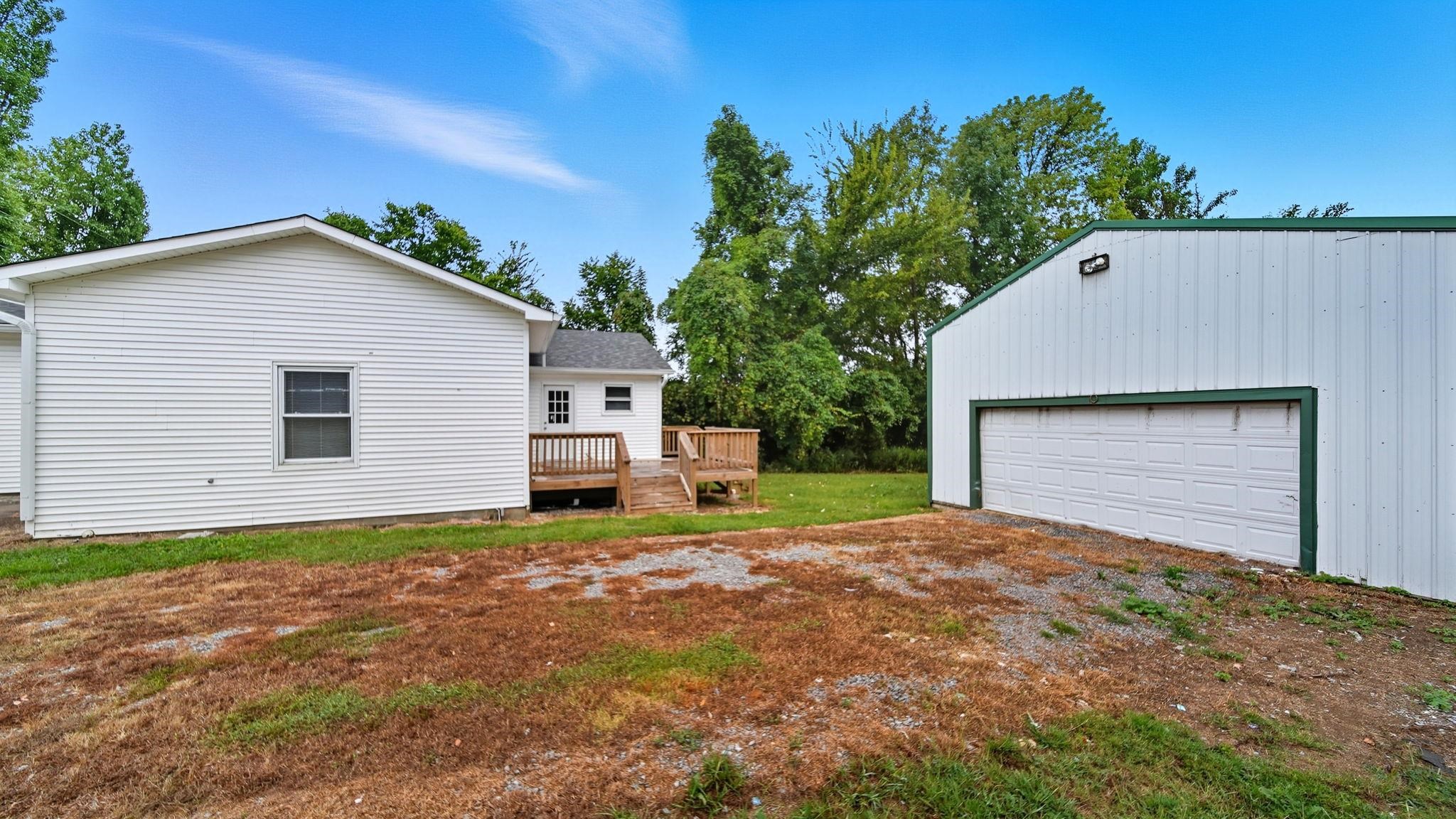 1503 Beaver Road Munford, TN 38058 - Photo 27 of 29 a view of a house with a yard and garage