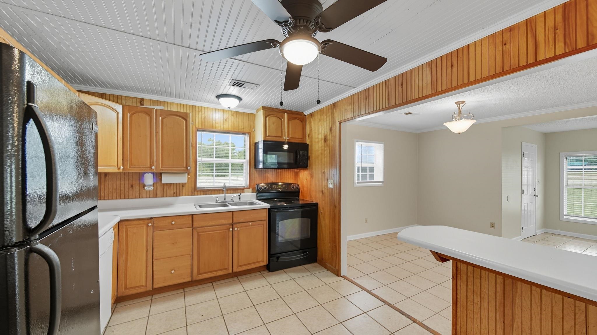 1503 Beaver Road Munford, TN 38058 - Photo 8 of 29 a kitchen with stainless steel appliances granite countertop a sink a stove and refrigerator