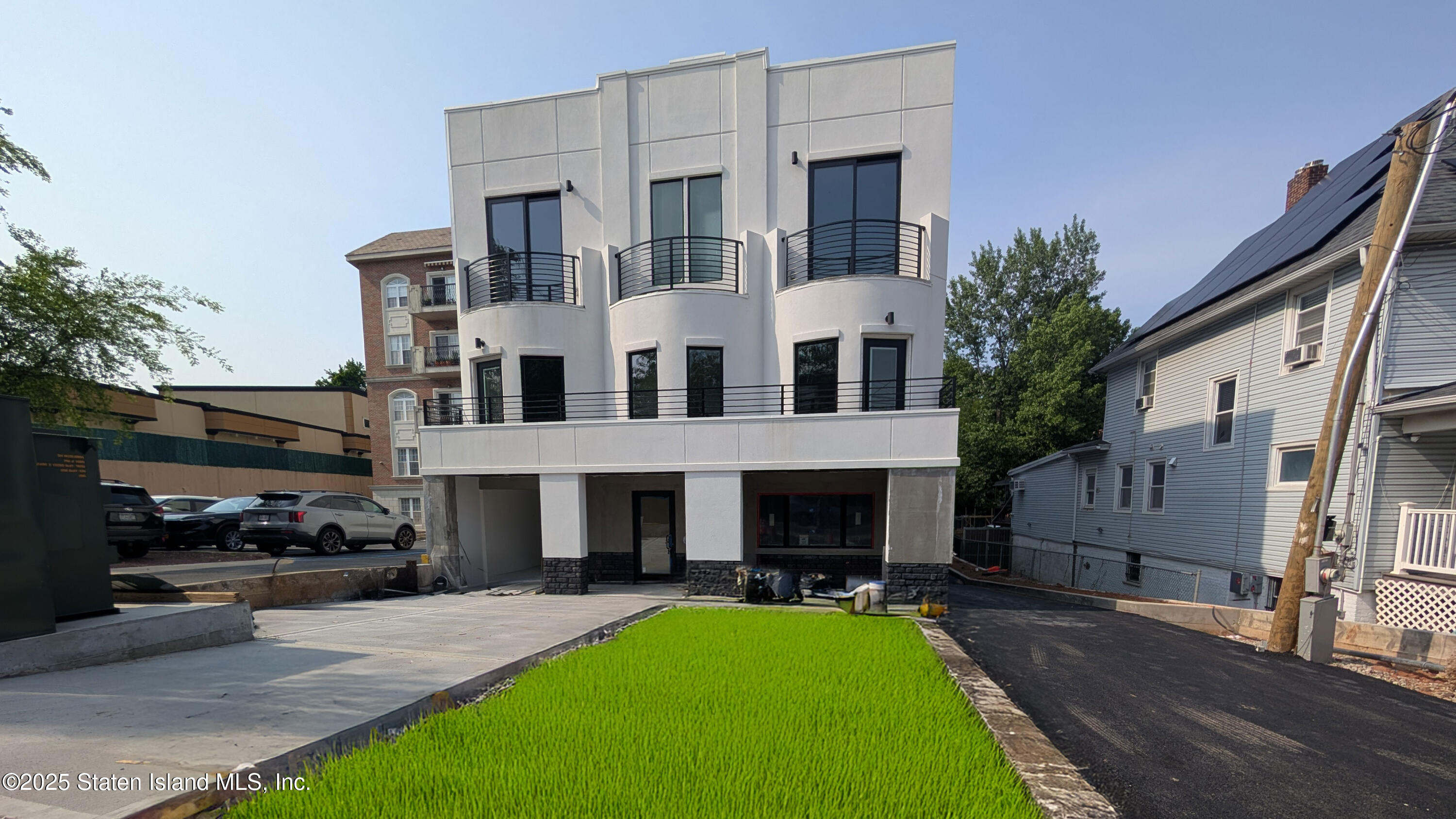 3865 Amboy Road, Unit 4B Staten Island, NY 10308 - Photo 3 of 15 a view of multiple house with a yard