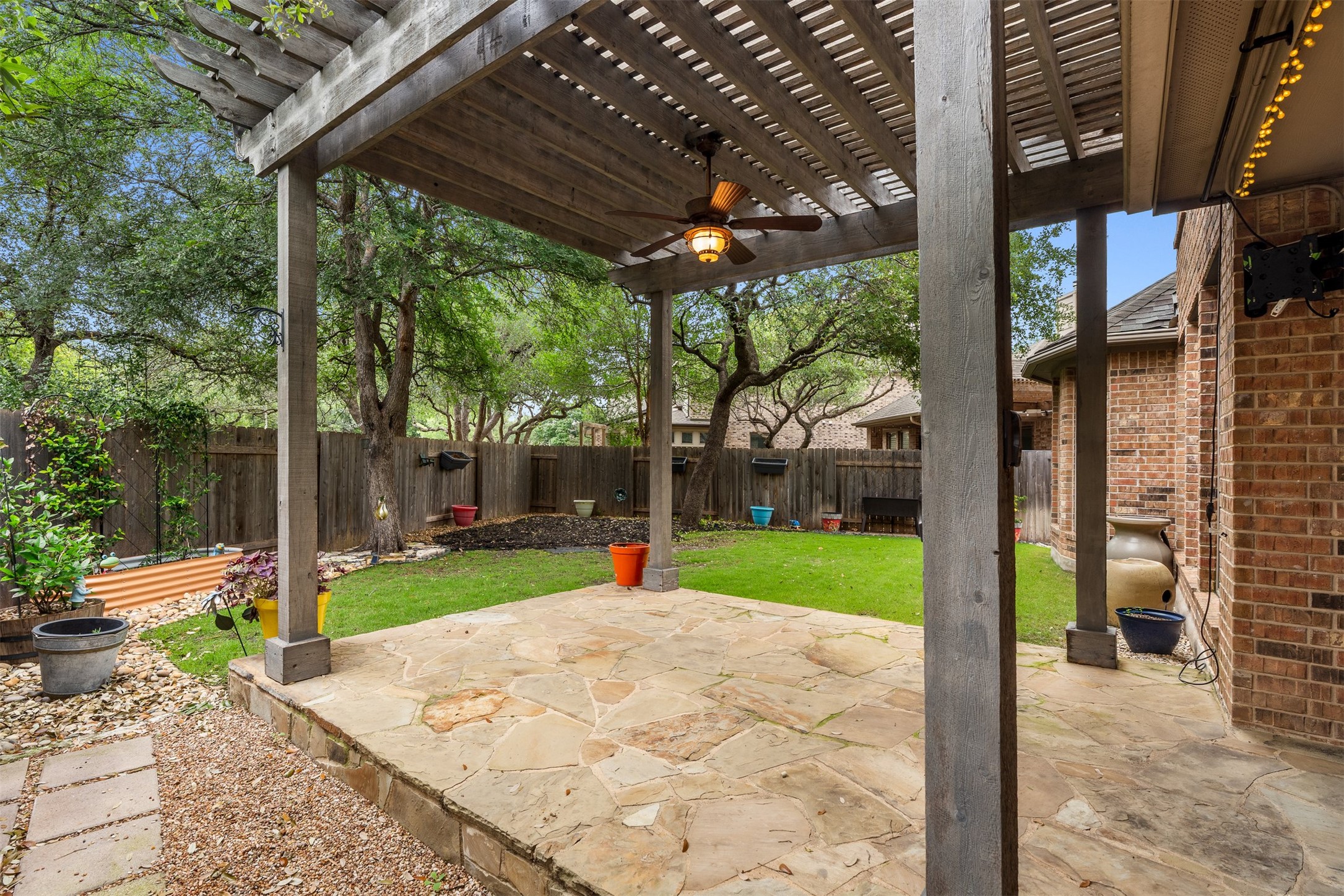 3935 Bowstring Bend Cedar Park, TX 78613 - Photo 34 of 39 The covered back patio is the perfect spot for outdoor dining while staying shaded from the Texas sun