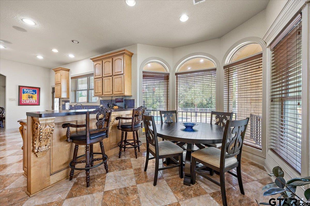 a view of a dining room with furniture window and outside view