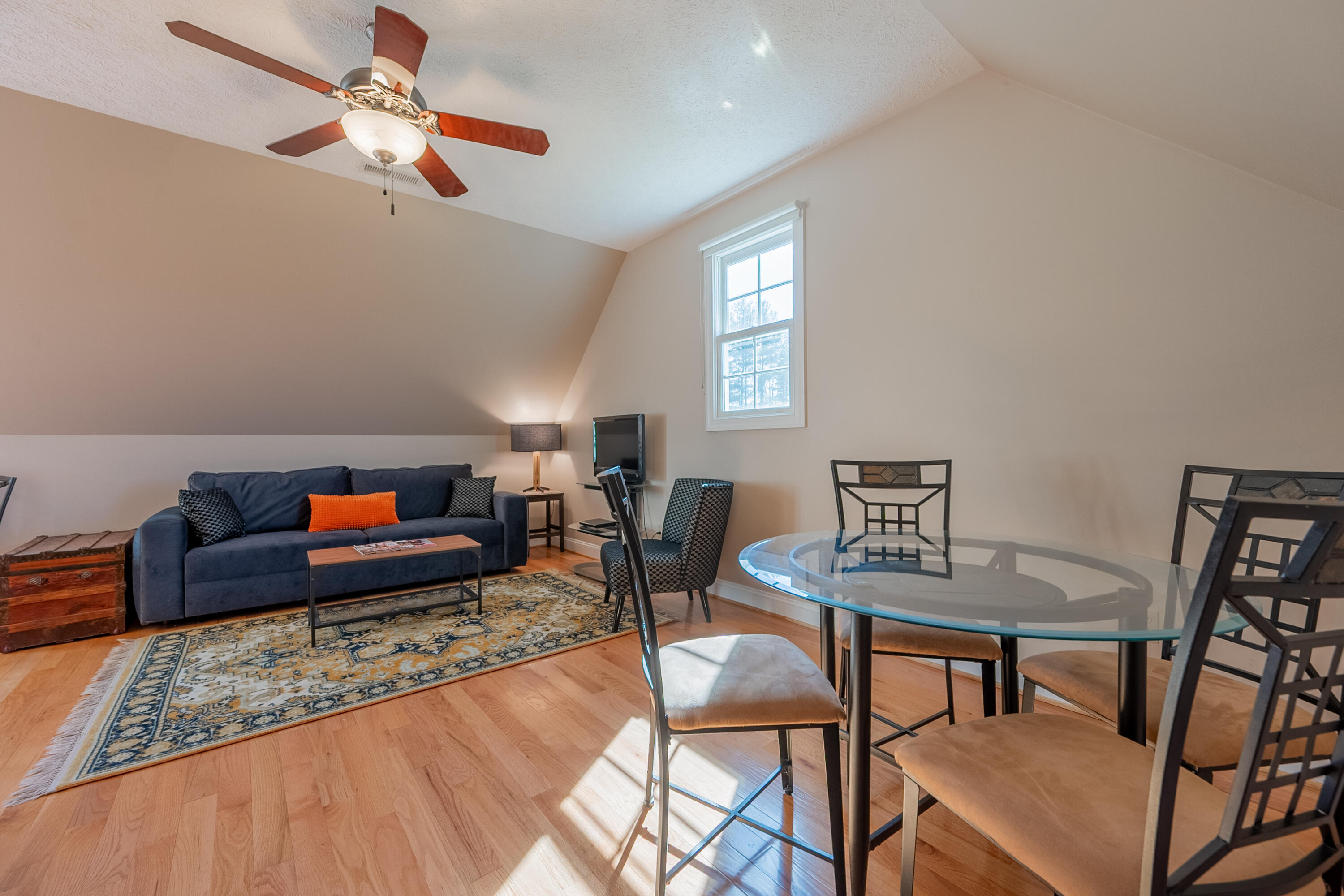 254 Dusty Mile Road Northwest Willis, VA 24380 - Photo 101 of 122 a living room with furniture and a wooden floor