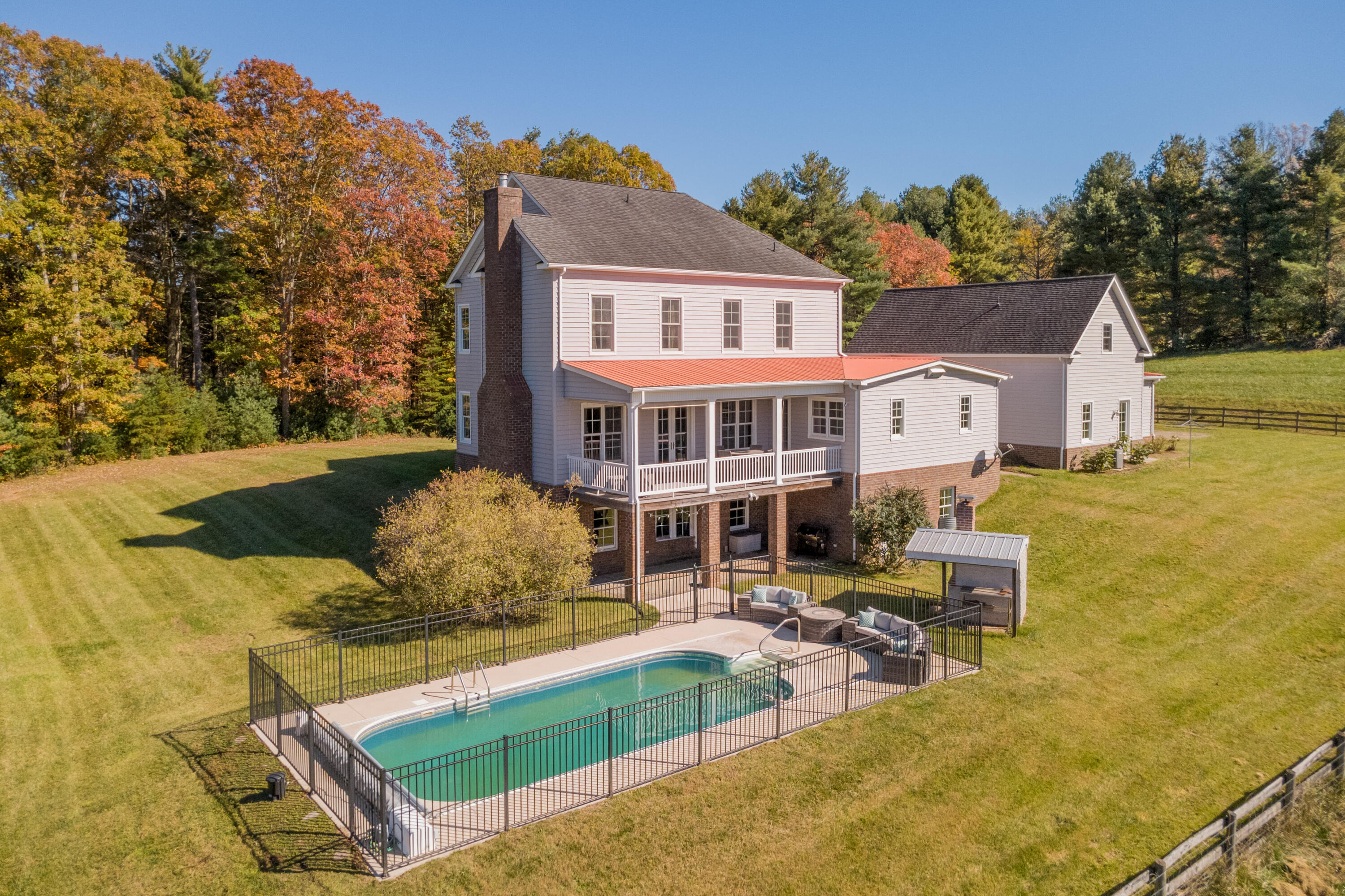 254 Dusty Mile Road Northwest Willis, VA 24380 - Photo 110 of 122 a view of a house with swimming pool and sitting area