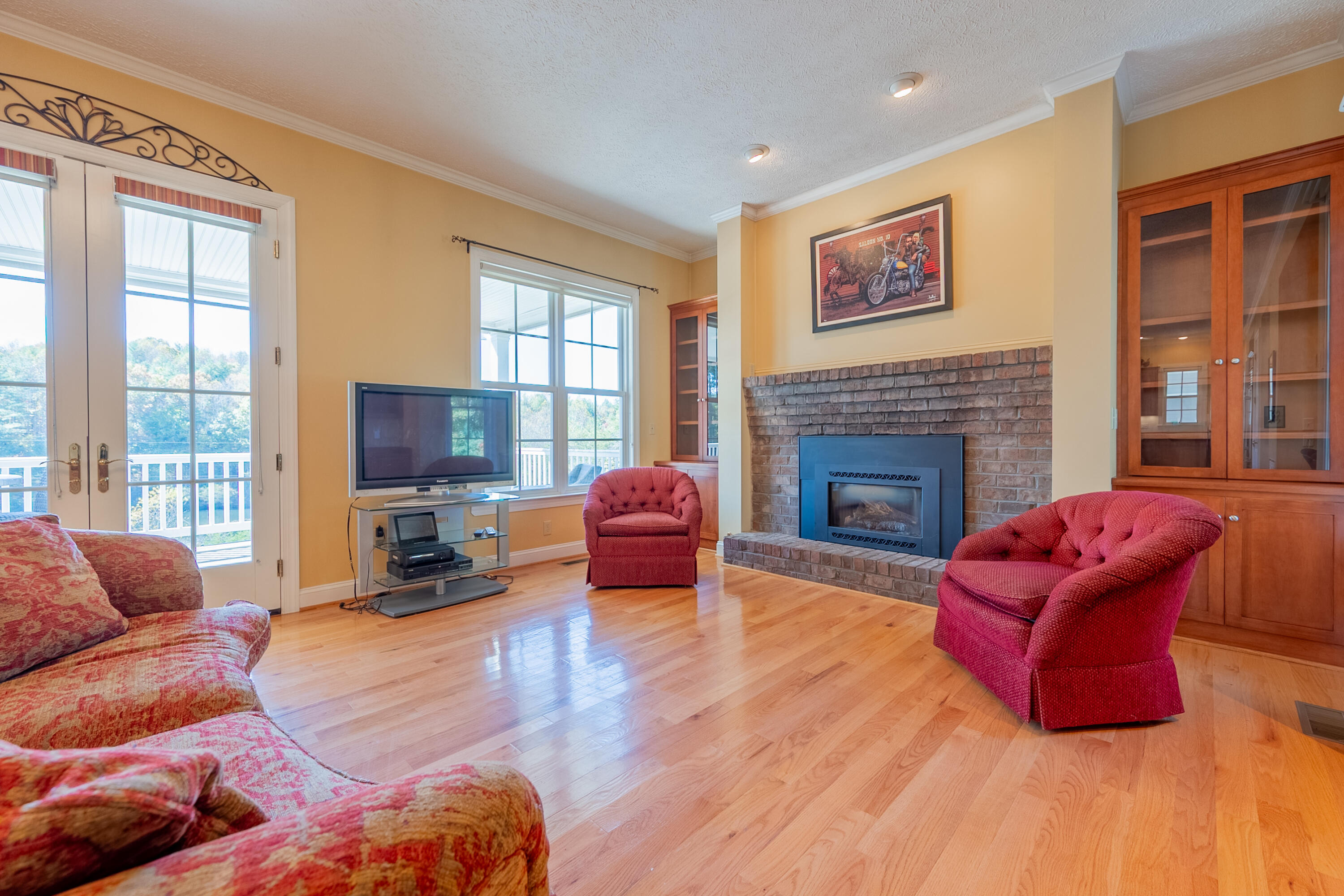 254 Dusty Mile Road Northwest Willis, VA 24380 - Photo 18 of 122 a living room with furniture window and a fireplace