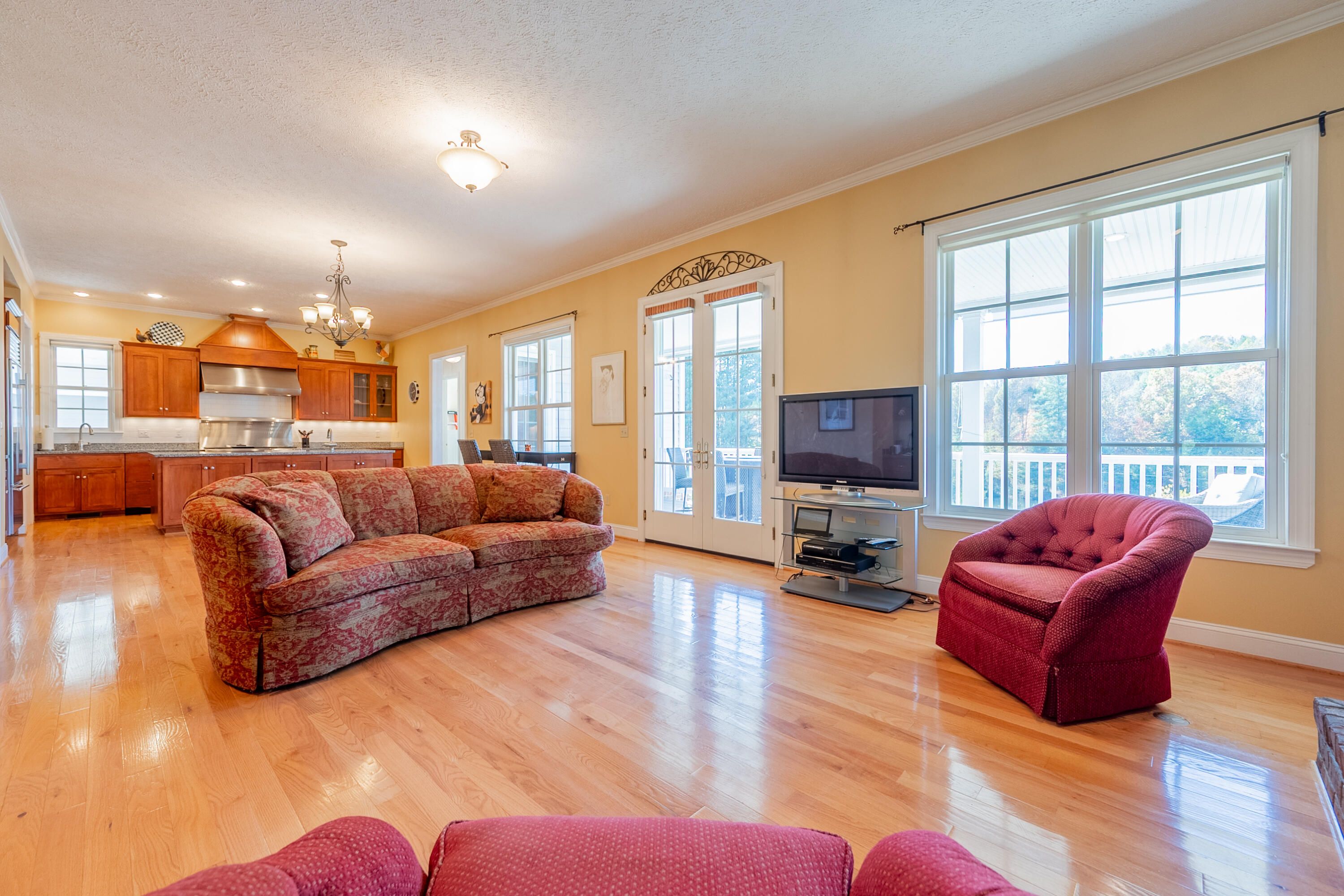 254 Dusty Mile Road Northwest Willis, VA 24380 - Photo 19 of 122 a living room with furniture a flat screen tv and a large window