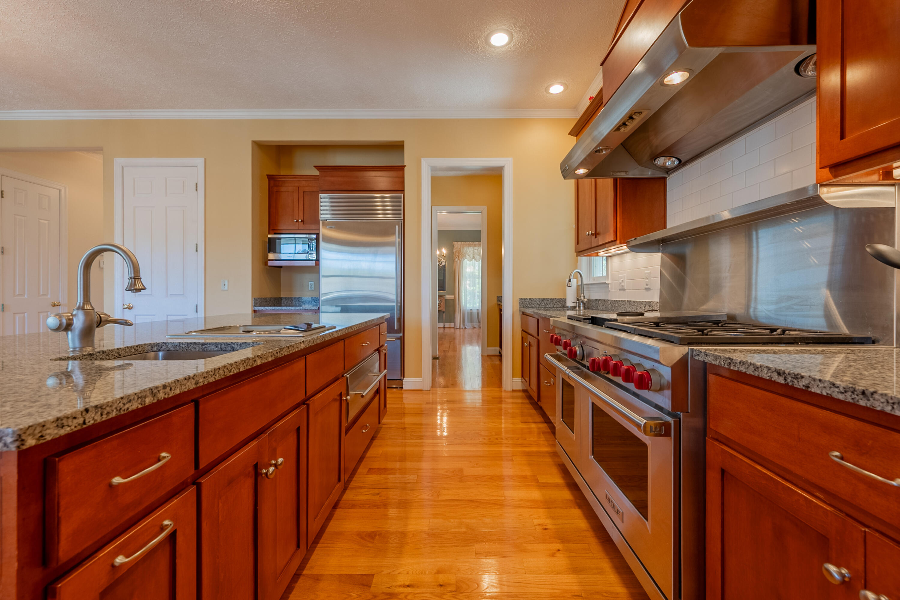 254 Dusty Mile Road Northwest Willis, VA 24380 - Photo 25 of 122 a large kitchen with stainless steel appliances granite countertop a stove and a sink