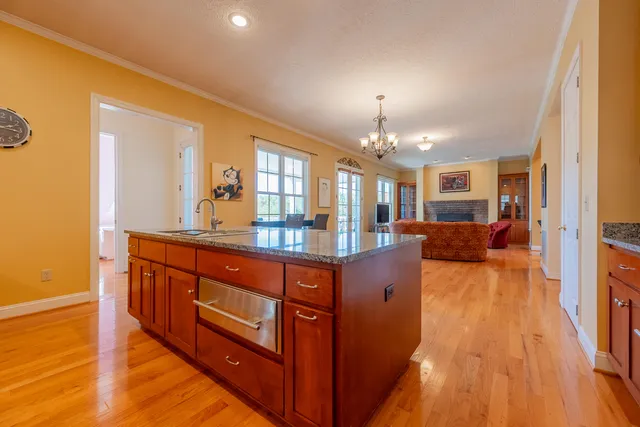 a spacious bathroom with a double vanity sink a mirror and a bathtub