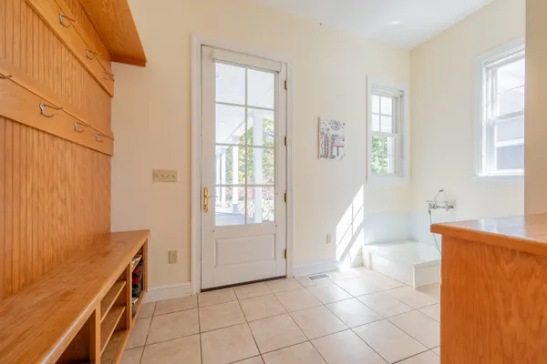 a bath tub sitting in a bathroom next to a window