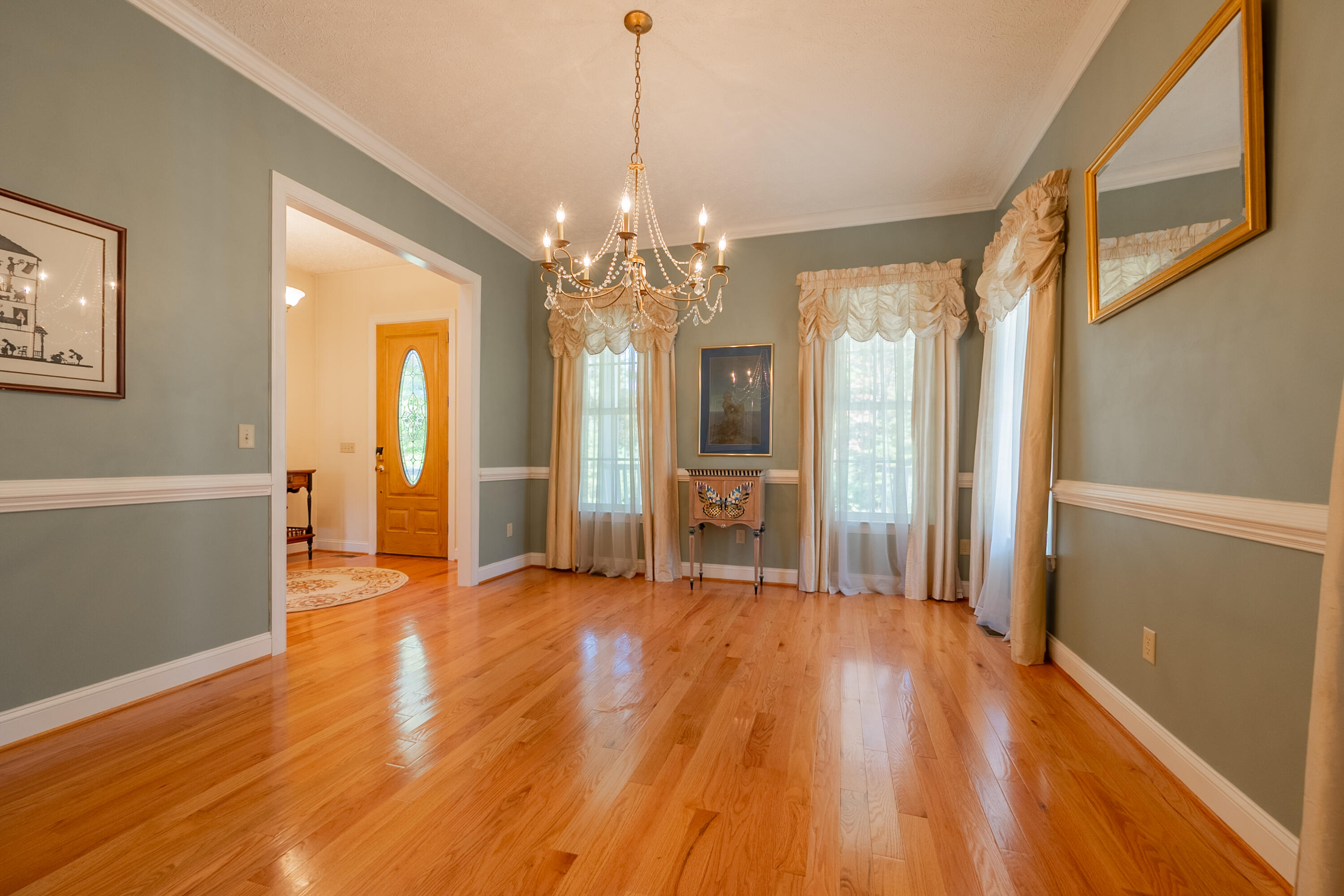 254 Dusty Mile Road Northwest Willis, VA 24380 - Photo 40 of 122 a view of a big room with wooden floor and windows