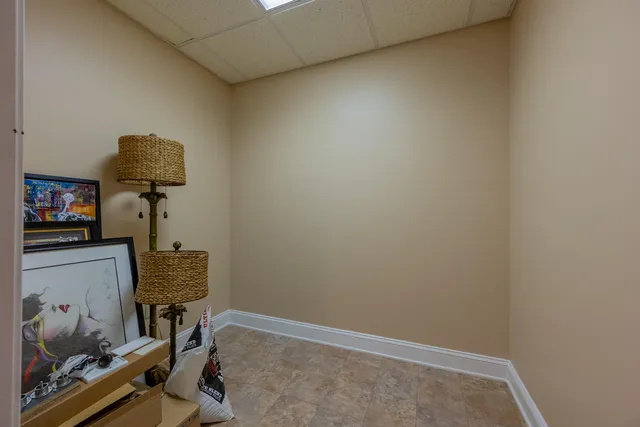 a bedroom with furniture and a wooden floor