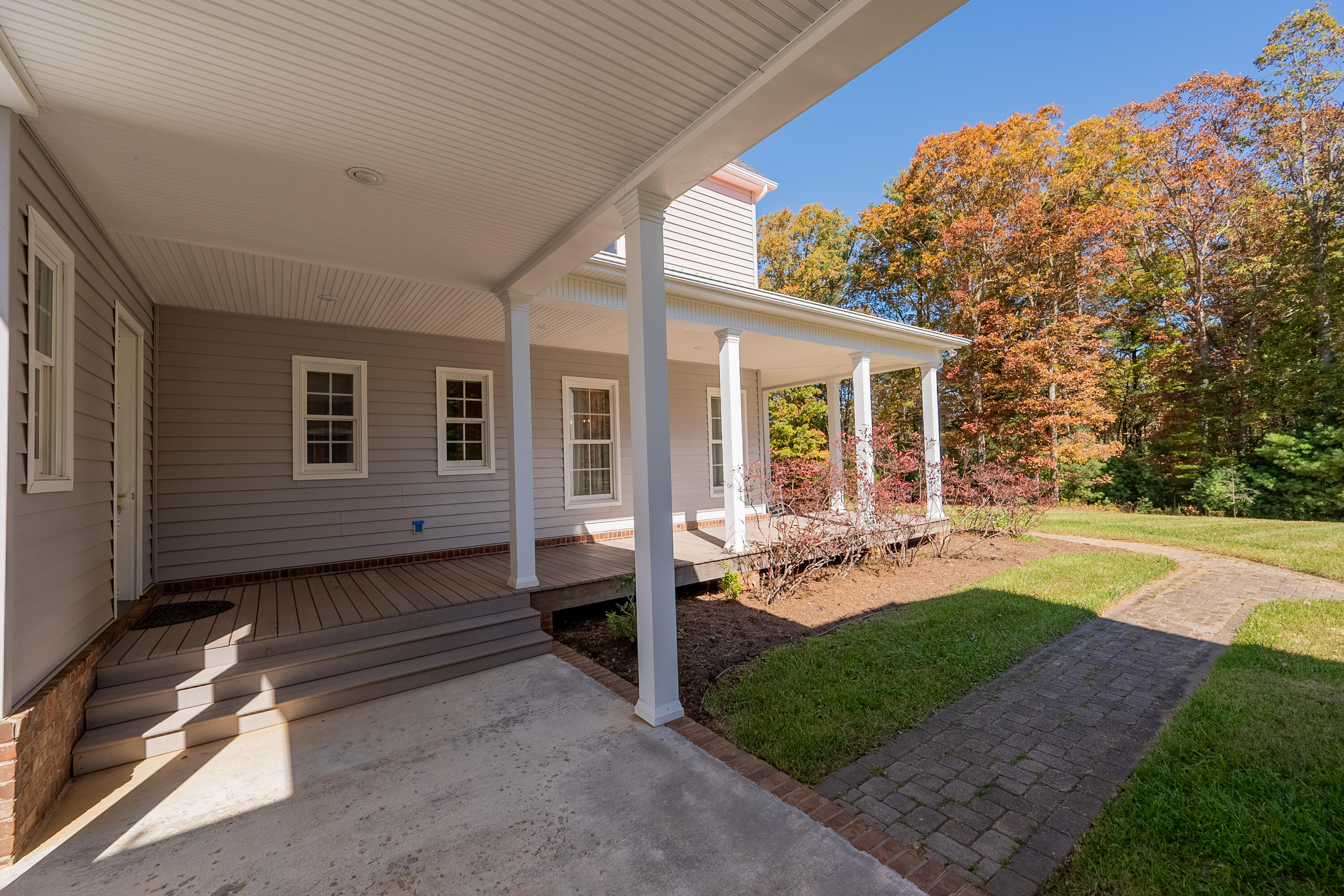 254 Dusty Mile Road Northwest Willis, VA 24380 - Photo 5 of 122 a view of a house with backyard sitting area and garden