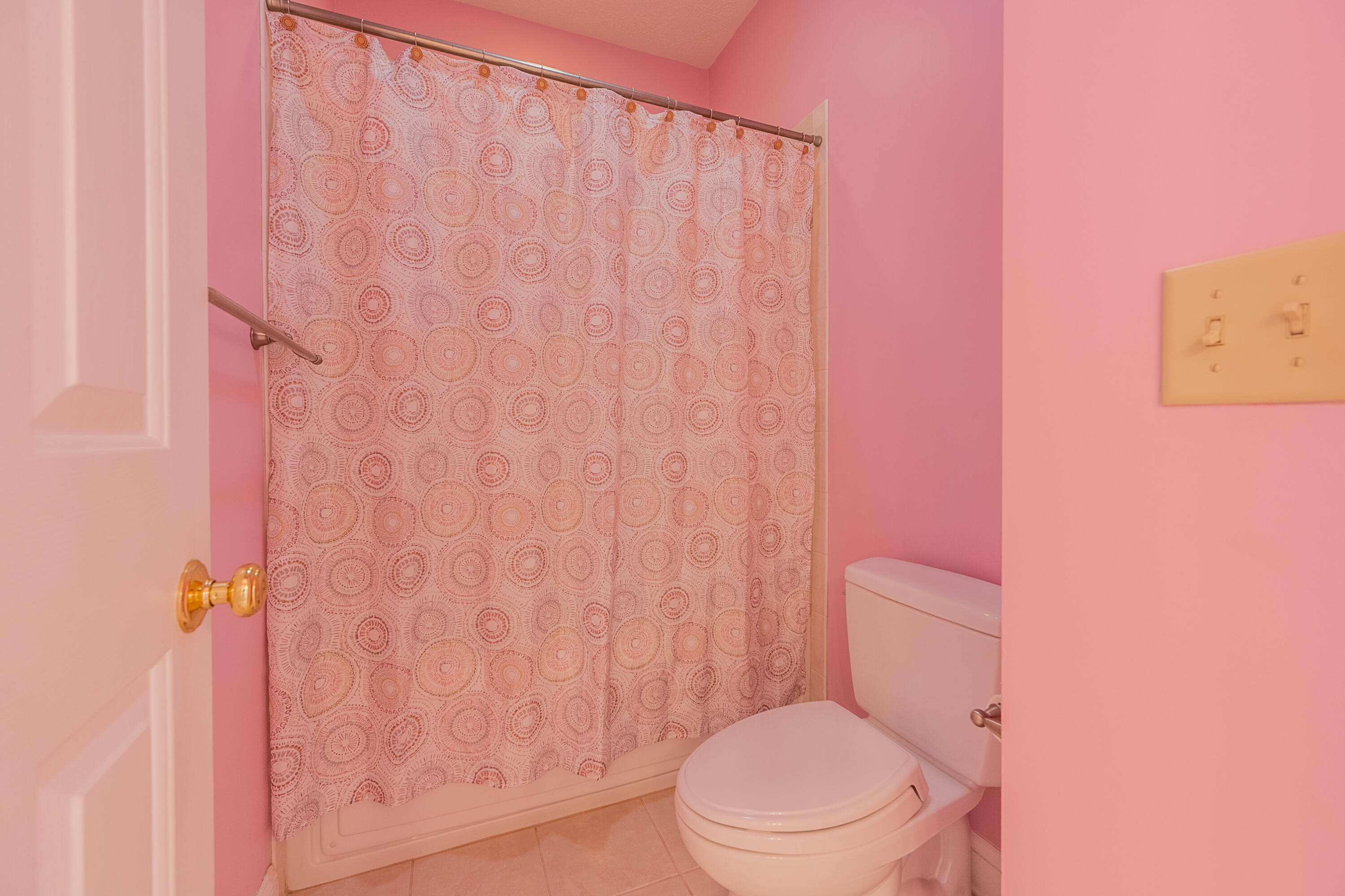 254 Dusty Mile Road Northwest Willis, VA 24380 - Photo 73 of 122 a white toilet sitting next to a shower curtain