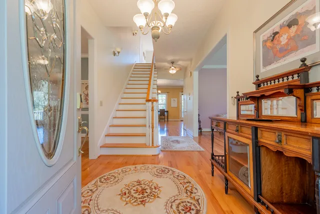 a living room with furniture wooden floor and a fireplace