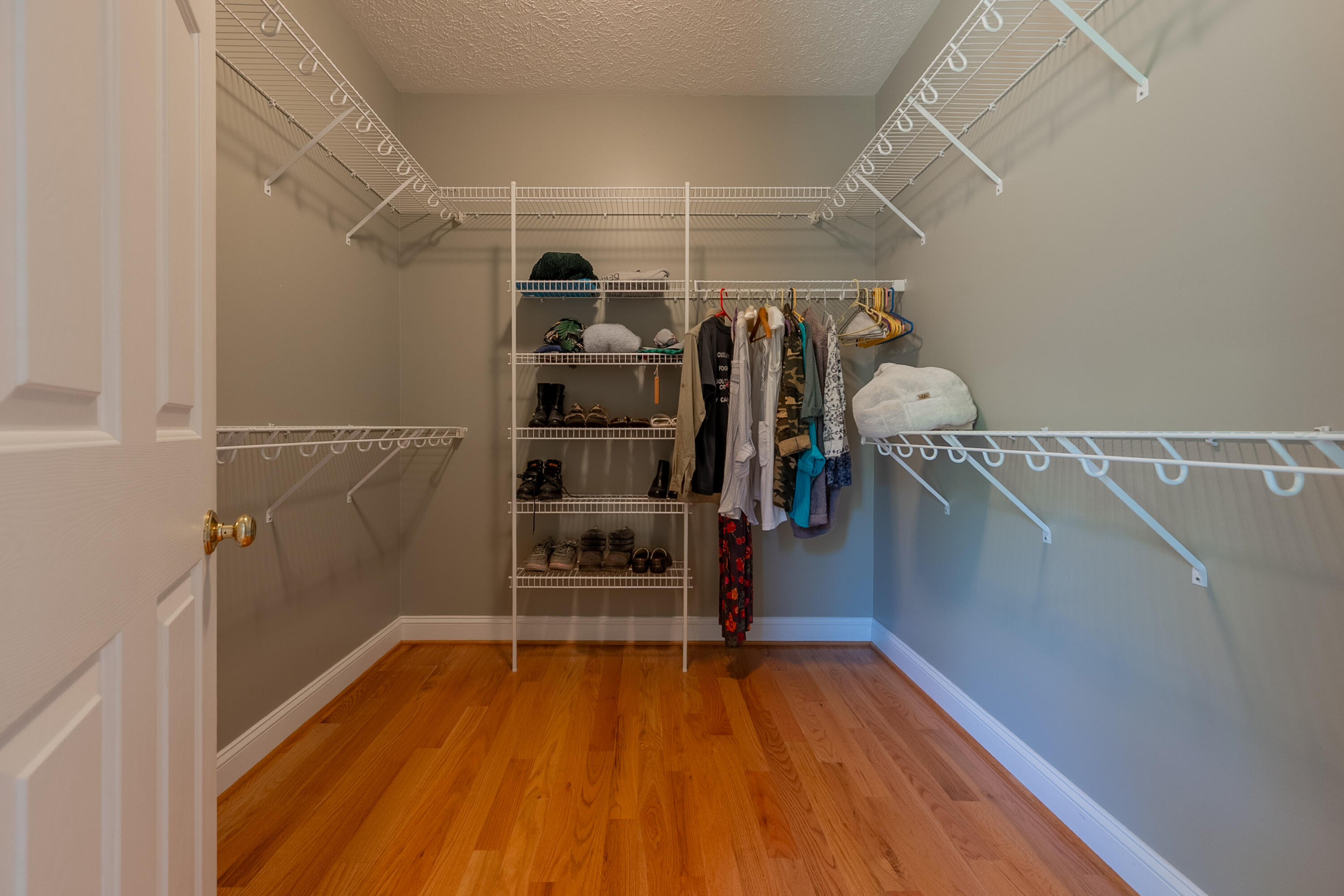254 Dusty Mile Road Northwest Willis, VA 24380 - Photo 84 of 122 a view of walk in closet with clothes and shoes