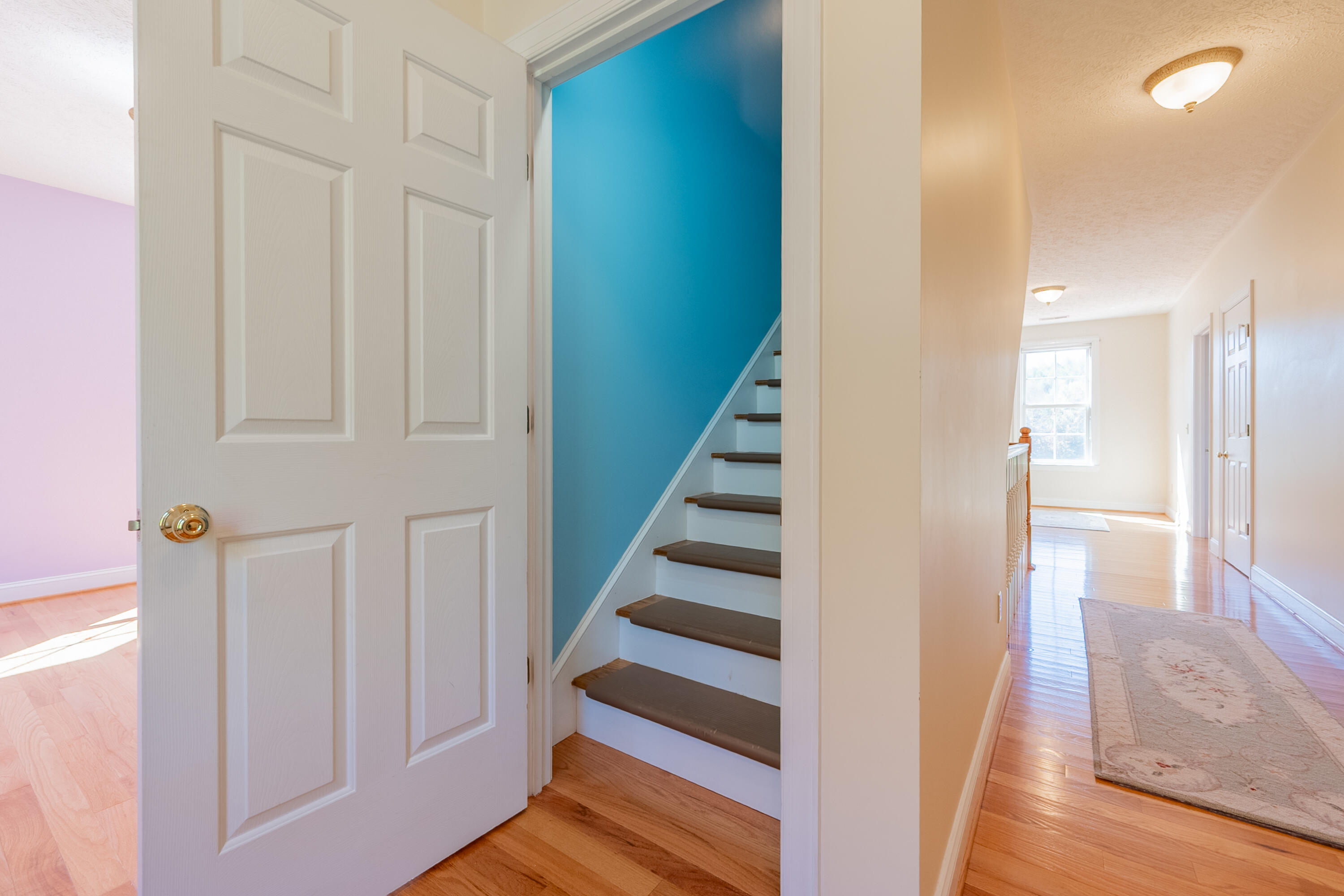 254 Dusty Mile Road Northwest Willis, VA 24380 - Photo 89 of 122 a view of a hallway with wooden floor and entryway