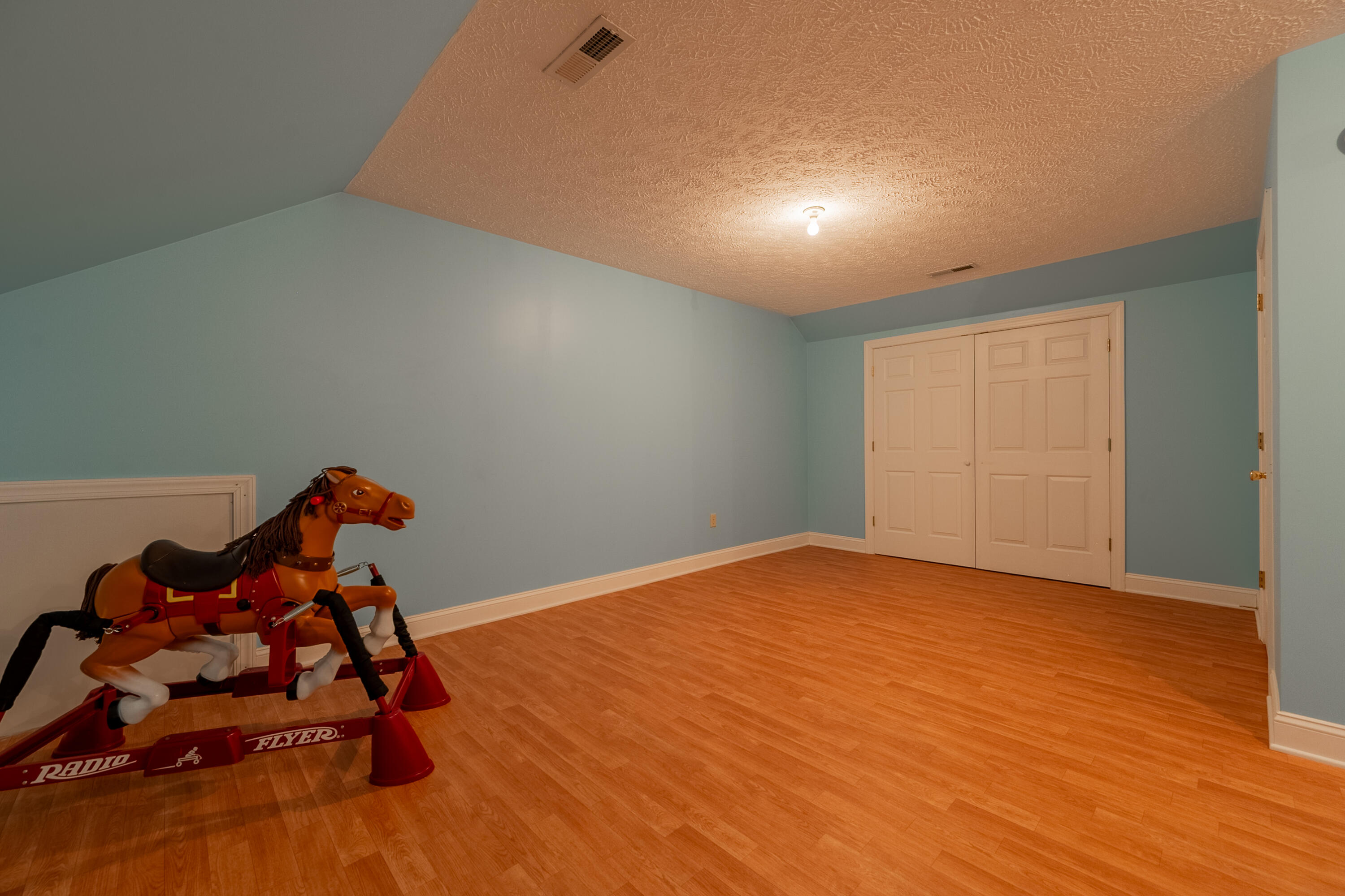 254 Dusty Mile Road Northwest Willis, VA 24380 - Photo 93 of 122 a view of a room with gym equipment and wooden floor